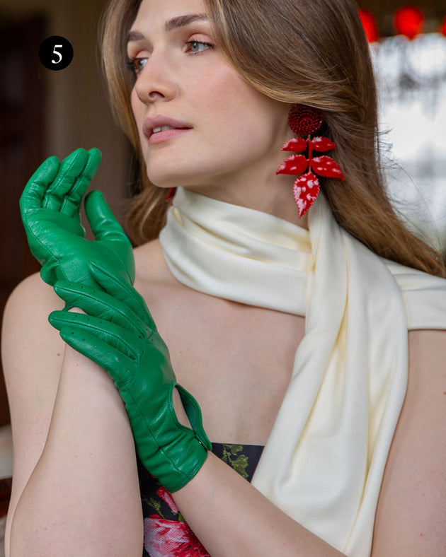 Woman wearing plain pashmina scarf in ivory with leather driving gloves in emerald