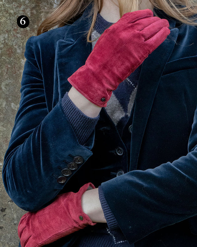 Woman wearing lined suede gloves in claret