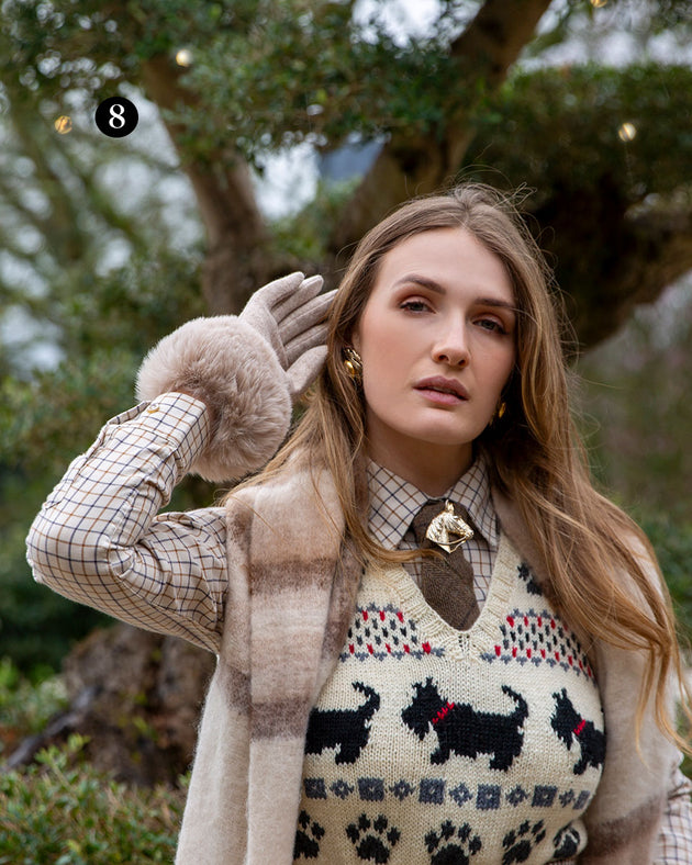 Woman wearing womens gloves with faux fur cuffs in natural with a plaid scarf in the park